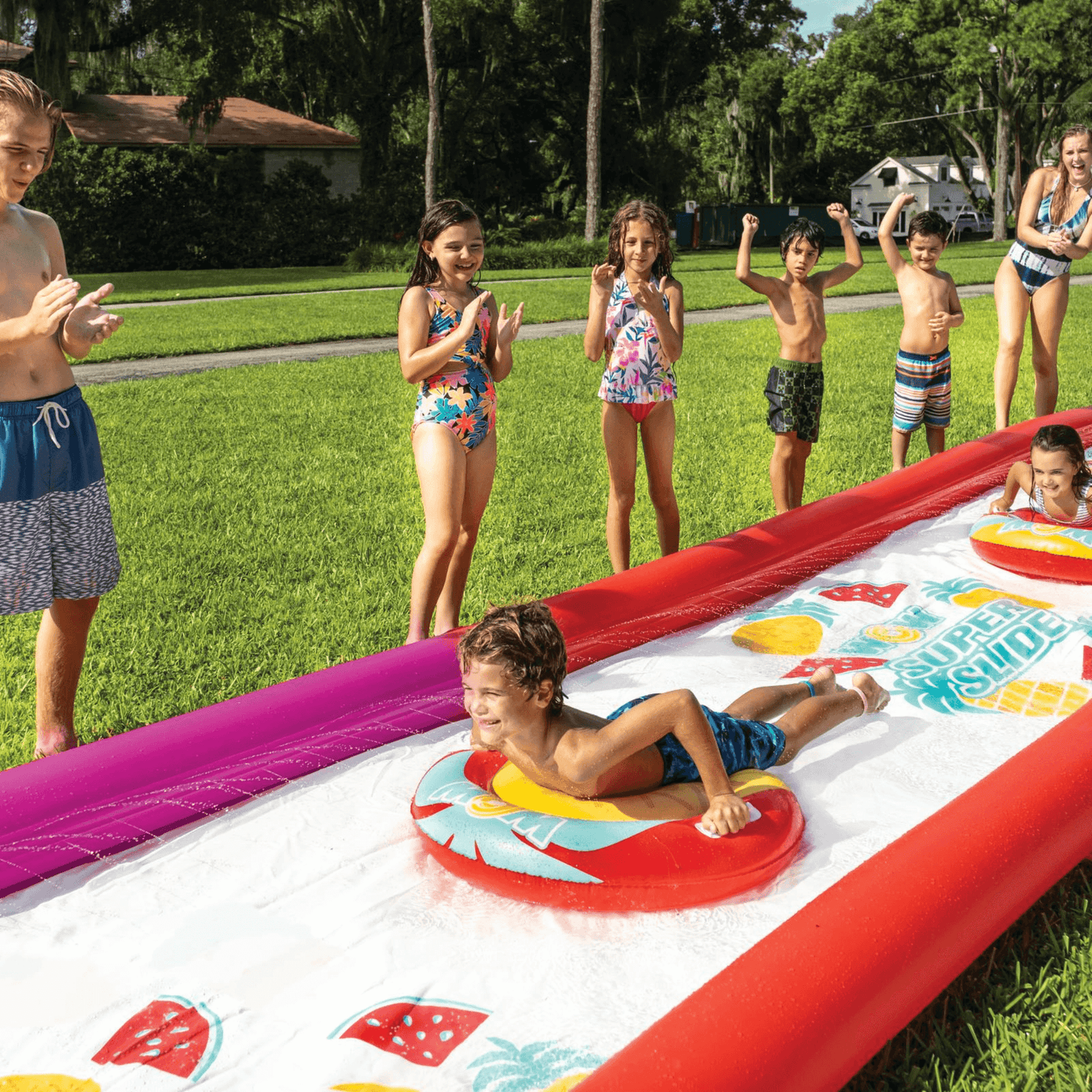 WOW Watersports Giant Backyard Double Lane Lawn Slide, Heavy Duty PVC and 2 Inflatable Sleds